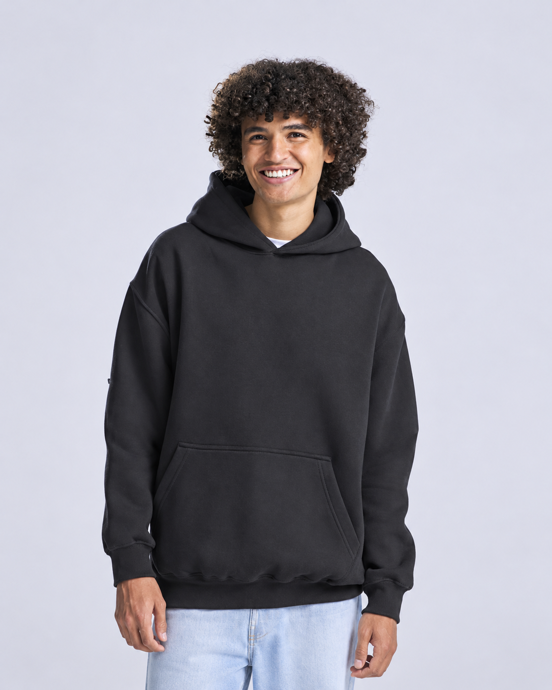 Model wearing a black AWDis hoodie