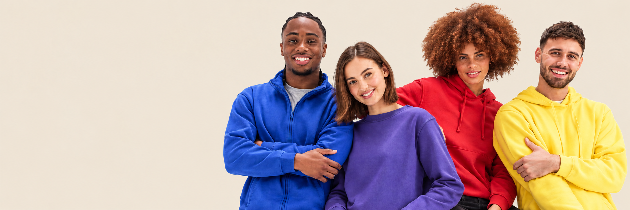 Four clothing models against a beige studio background